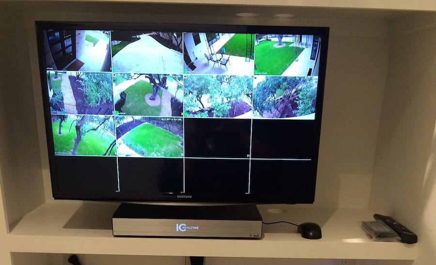 IC Real-time security monitor with ten surveillance feeds simultaneously showing